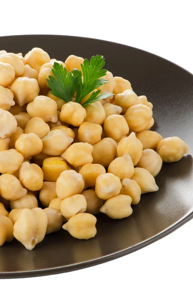 Chickpeas in a brown plate — Stock Photo, Image