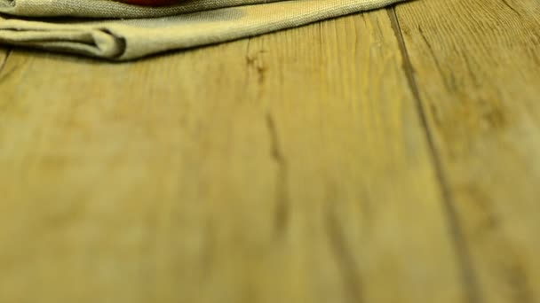 Apple mango and juice sliding on wood table top on black background — Stock Video