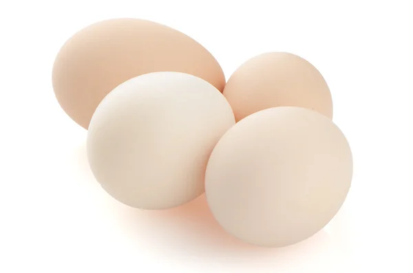 Vier Eier auf weiß — Stockfoto