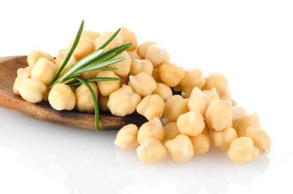 Chickpeas over wooden spoon — Stock Photo, Image