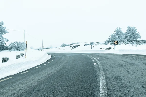 Snowy vej - Stock-foto