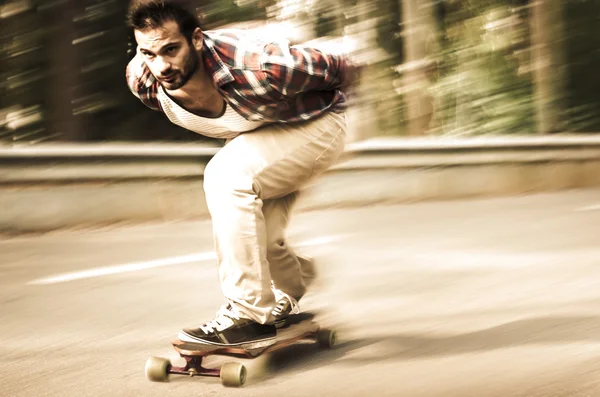 Downhill skateboarder in action — Stock Photo, Image