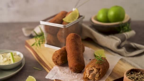 Meat Croquets Rosemary Leaves Lemons Wooden Cutting Board Kitchen Counter — Stockvideo