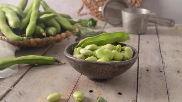 Fresh Raw Green Broad Beans Wooden Table — Wideo stockowe