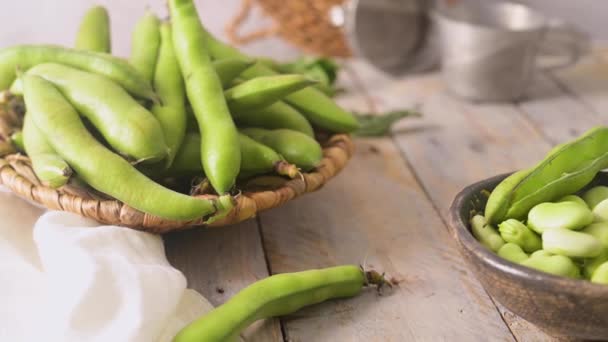 Fresh Raw Green Broad Beans Wooden Table — Vídeos de Stock