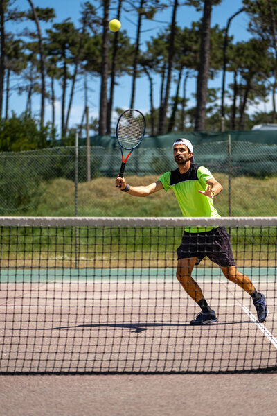 Tennis Player Performing Smash Court Stock Photo
