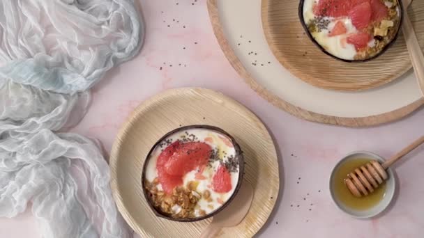 Yogurt Grapefruit Granola Chia Honey Served Half Coconut Shell Rose — Stockvideo