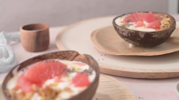 Yogurt Grapefruit Granola Chia Honey Served Half Coconut Shell Rose — Stockvideo