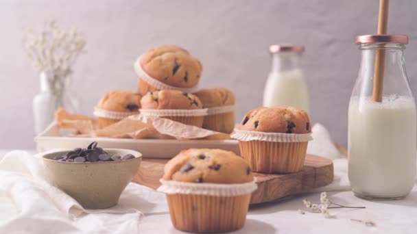 Chocolate Chip Muffins Milk Served Glass Bottles White Kitchen Countertop — ストック動画