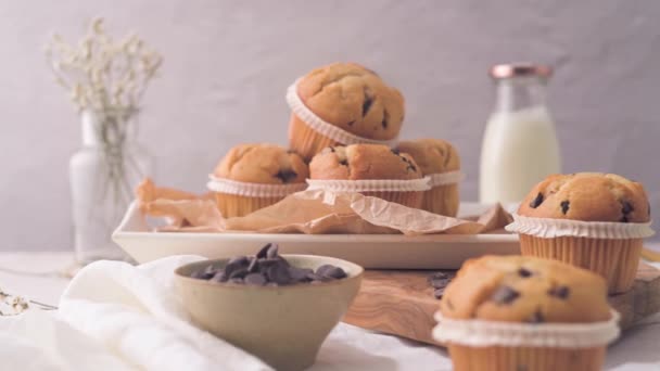 Chocolate Chip Muffins Milk Served Glass Bottles White Kitchen Countertop — Stockvideo