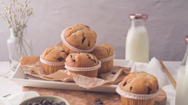 Chocolate Chip Muffins Milk Served Glass Bottles White Kitchen Countertop — ストック動画