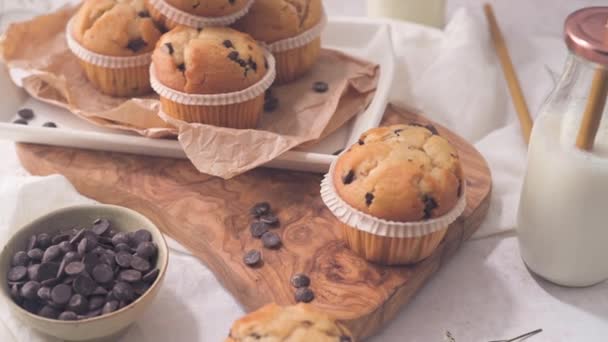 Chocolate Chip Muffins Milk Served Glass Bottles White Kitchen Countertop — Stok video