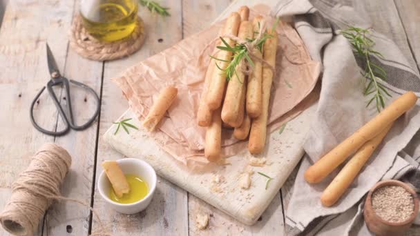 Traditional Italian Breadsticks Grissini Rosemary Olive Oil Sesame Seeds Wooden — Stockvideo