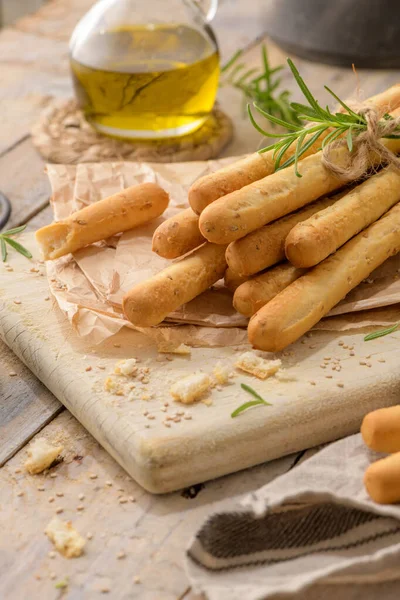 Traditional Italian Breadsticks Grissini Rosemary Olive Oil Sesame Seeds Wooden — Stok fotoğraf