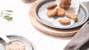 Breakfast concept with baked butter cookies, cappuccino coffee with creamy foam in ceramic cup.