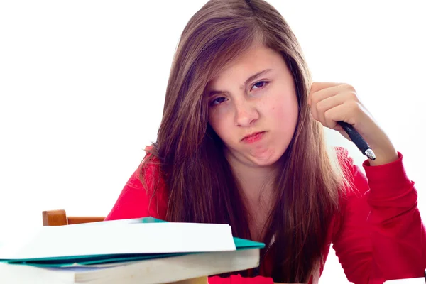 Girl Angry while doing School Work Stock Photo