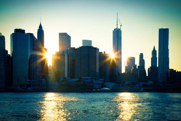 Lower Manhattan with sun flares through buildings