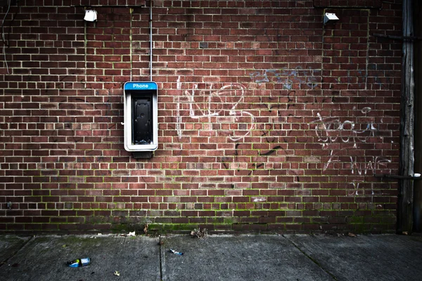 Telefonautomat grunge vägg — Stockfoto
