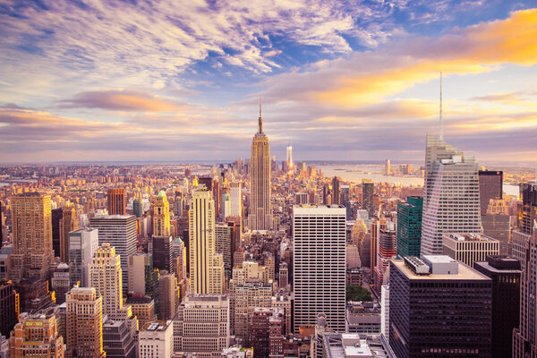 Sunset aerial view of New York City looking over midtown Manhattan towards downtown.