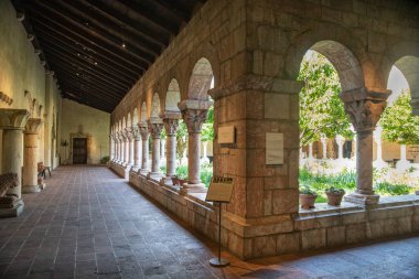 New York City, New York - June 29, 2019:  View of the Met Cloisters in Washington Height Manhattan with architectural details and people visiting in sight. 