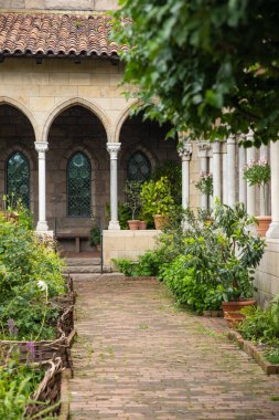 Exterior View of the Met Cloisters in Washington Height Manhattan with architectural details and garden