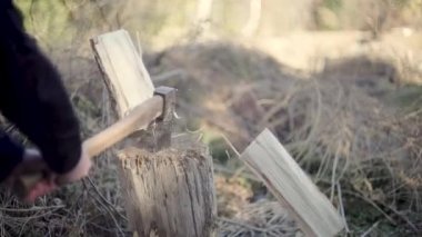 man chopping wood with an axe. High quality FullHD footage