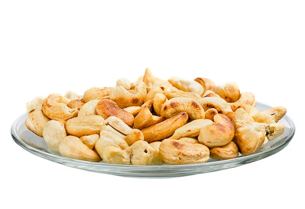 Saucer with roasted cashew nuts isolated on white background — Stock Photo, Image