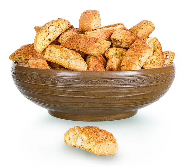 Hard, dry biscuit with almonds in a rural clay plate — Stock Photo, Image