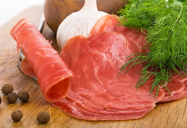 Still Life with slices of smoked meat — Stock Photo, Image