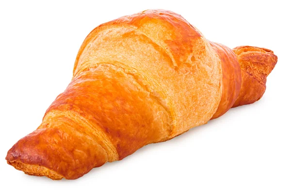 Gold-brown baked croissant in front of a white background — Stock Photo, Image