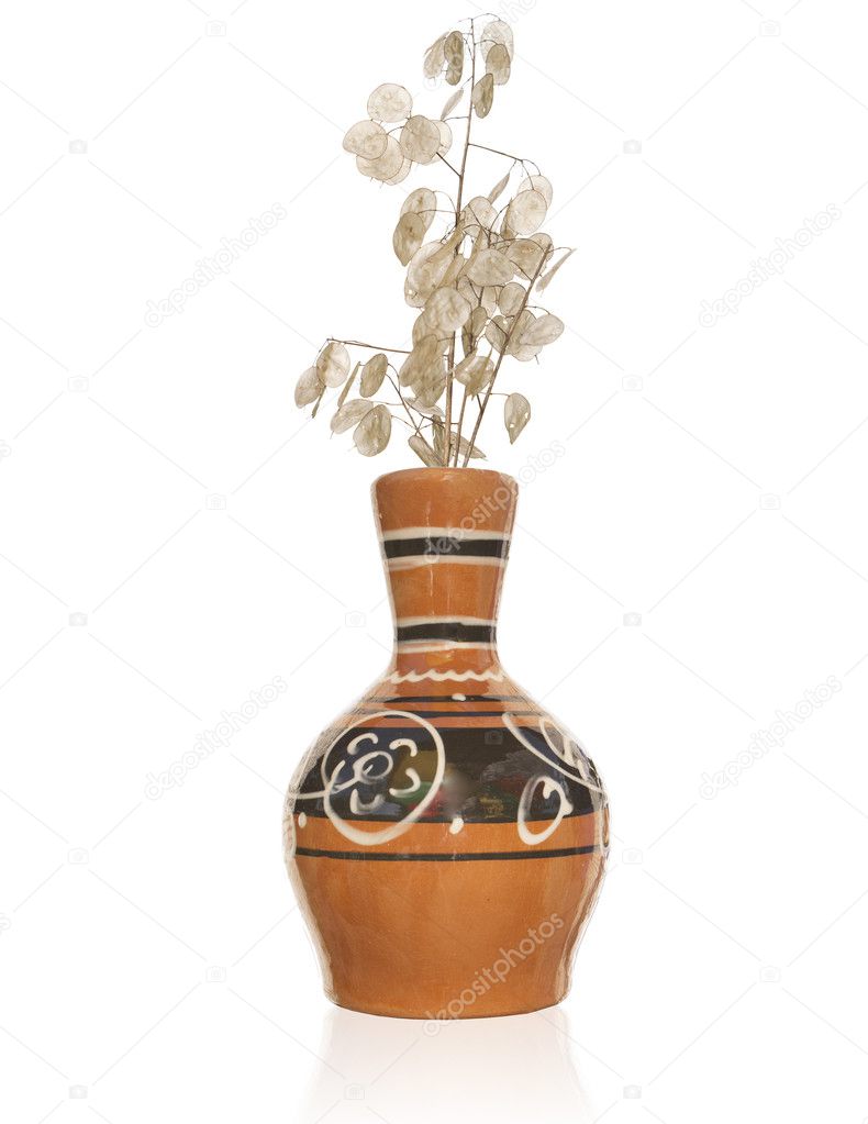 The vintage antique vase and dry bouquet decorative plant