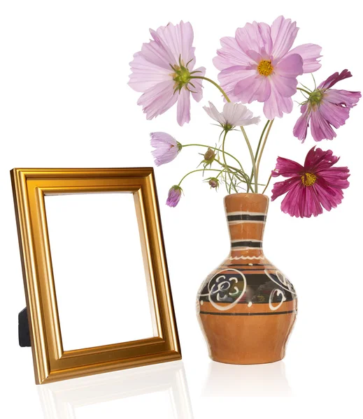 Photo frame and antique vase with decorative garden flower — Stock Photo, Image