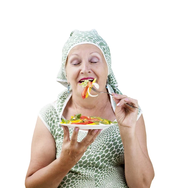 Mujer adulta comiendo ensalada de verduras frescas —  Fotos de Stock