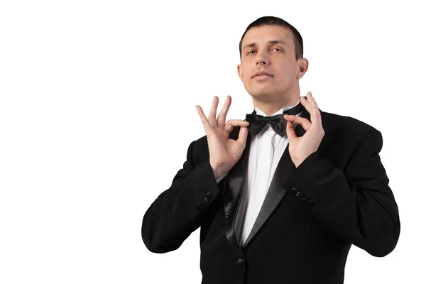 Mode volwassen man in zwarte tuxedo op witte achtergrond — Stockfoto