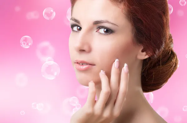 Beauty Woman Portrait. Beautiful Spa Woman Touching her Face. — Stock Photo, Image