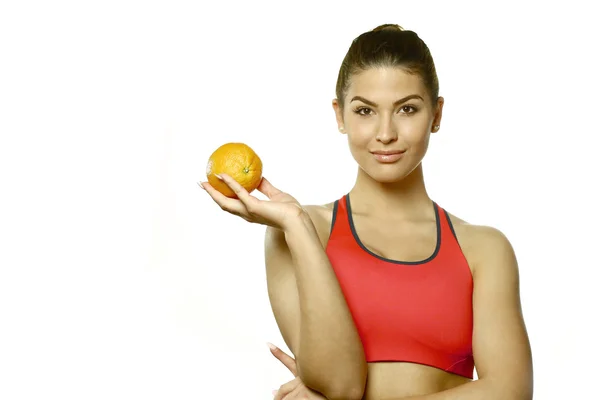 Bella giovane donna con arancione — Foto Stock