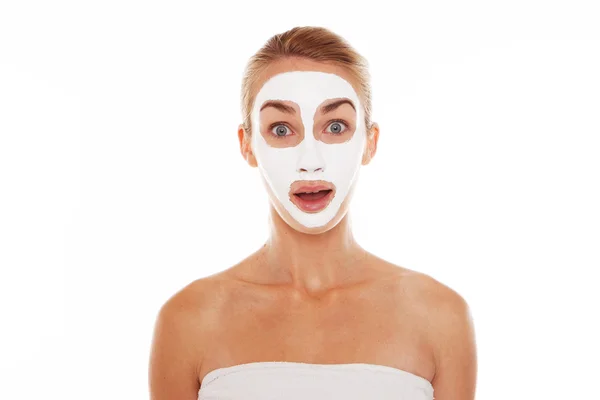 Woman in face mask with surprised expression — Stock Photo, Image