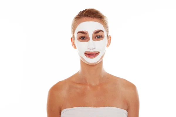 Smiling woman in a face mask — Stock Photo, Image