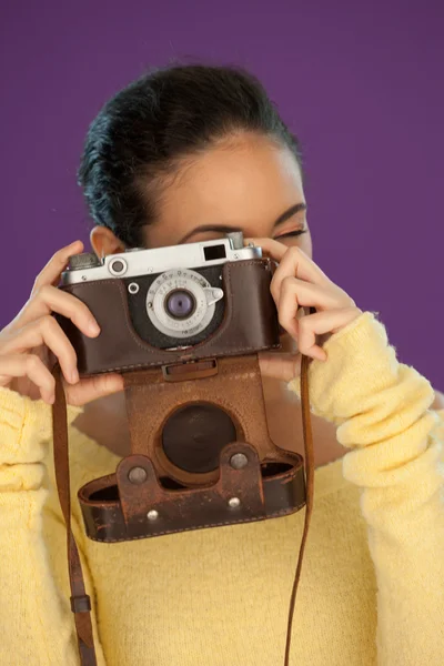 Woman using a vintage camera Stock Image