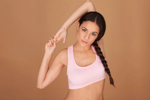 Mujer joven calentando —  Fotos de Stock