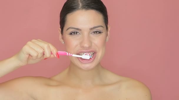 Beautiful woman with toothbrush — Stock Video