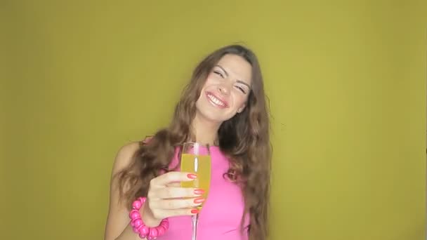 Happy woman partying with a drink in her hand — Stock Video