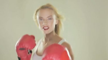 Blonde woman with boxing gloves