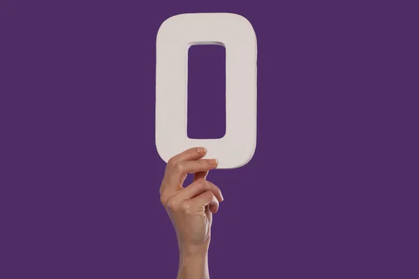 Female hand holding up the number 0 from the bottom — Stock Photo, Image