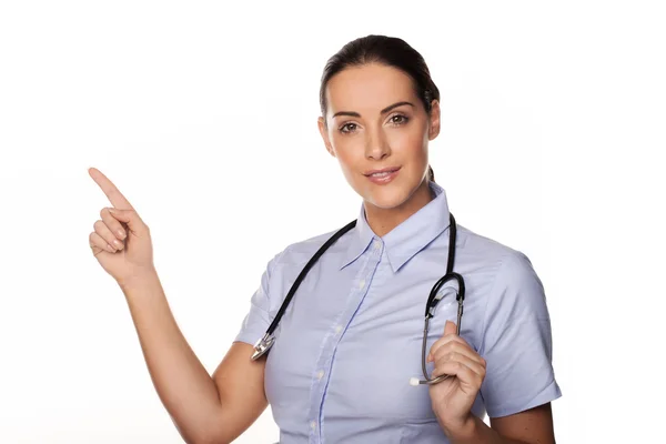 Doctor pointing with her finger — Stock Photo, Image