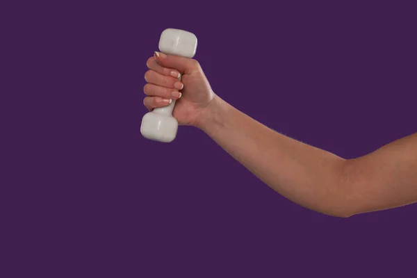 Female hand holding a dumbbell — Stock Photo, Image