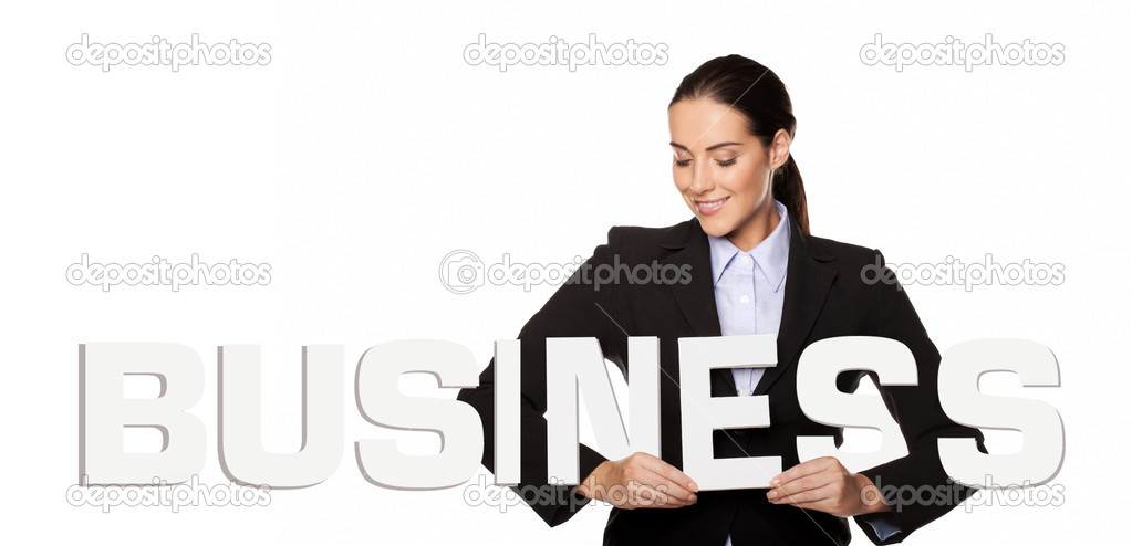 Smiling businesswoman with the word BUSINESS
