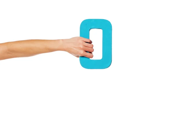 Hand holding up the number zero from the left — Stock Photo, Image