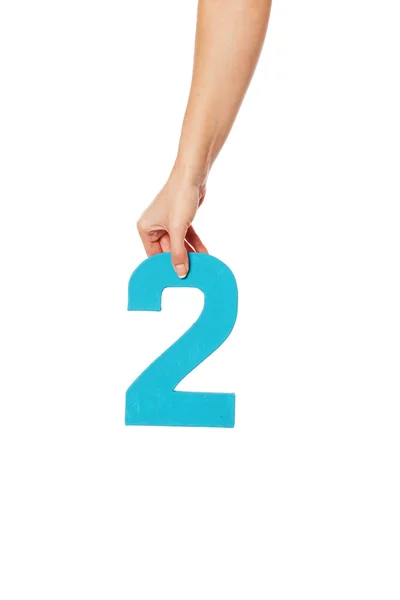 Hand holding up the number two from the top — Stock Photo, Image