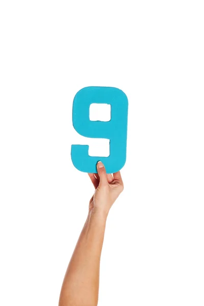 Hand holding up the number nine from the bottom — Stock Photo, Image